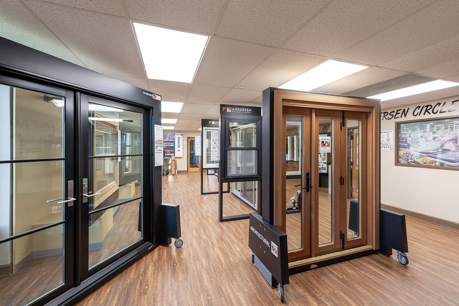 Interior view of a showroom with doors with hardwood flooring.